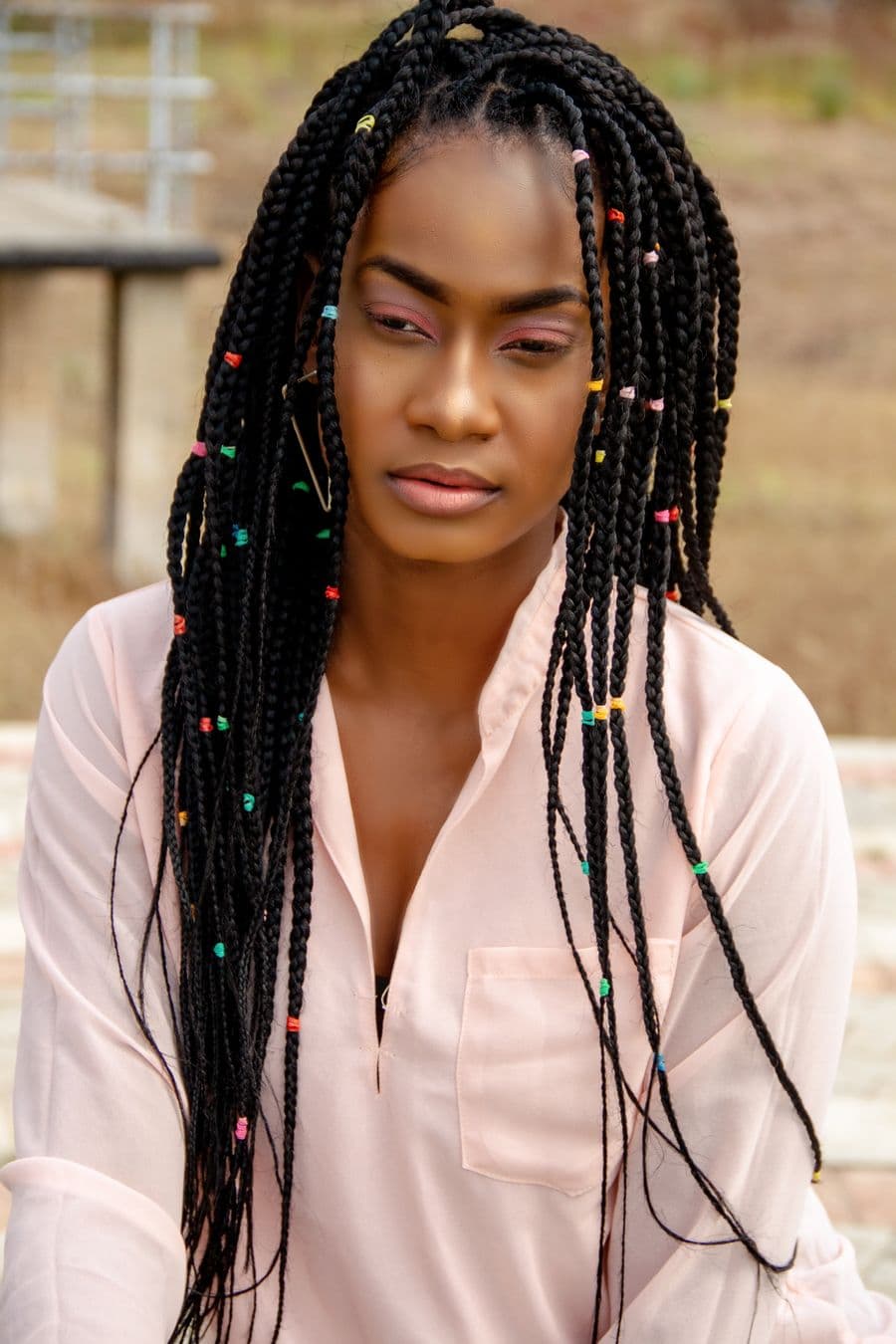 Braids adorned with beads and gold accents